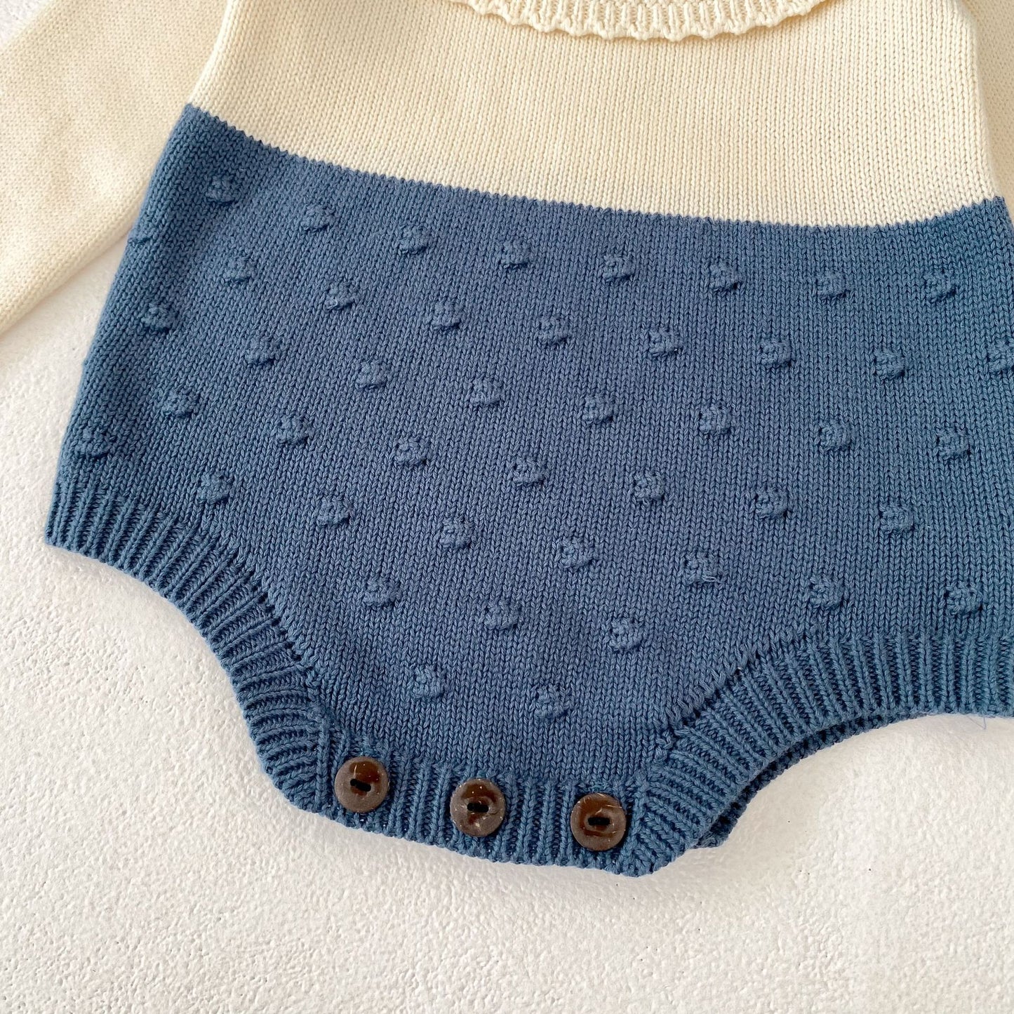 ヨーロピアンバイカラーニットロンパース