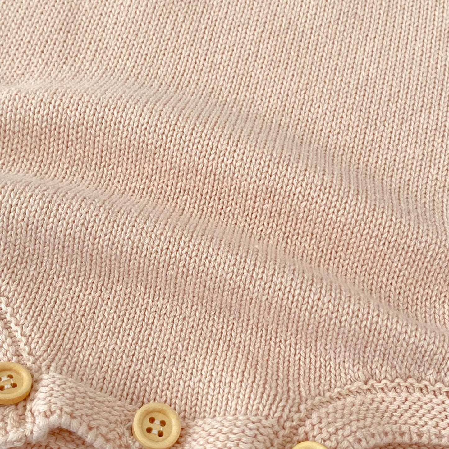 パステルピンクフリルニットロンパース