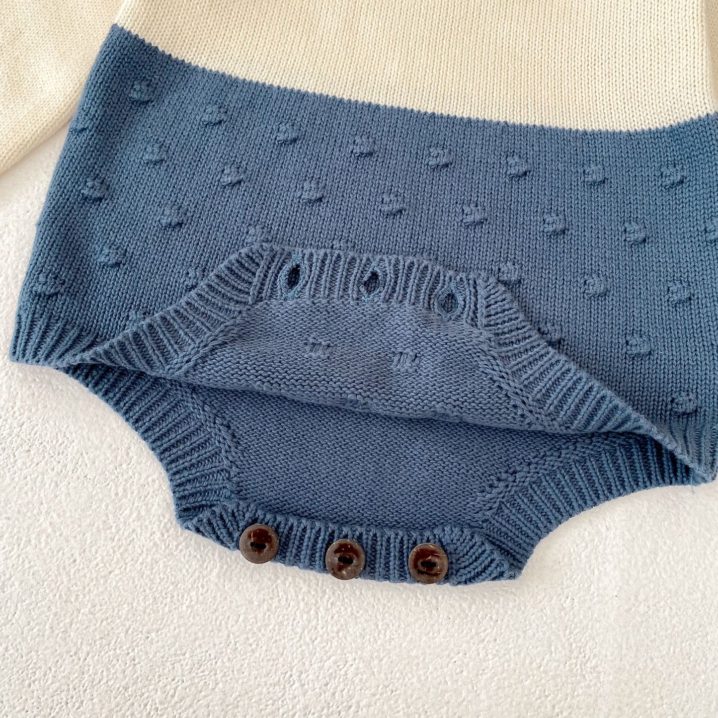 ヨーロピアンバイカラーニットロンパース