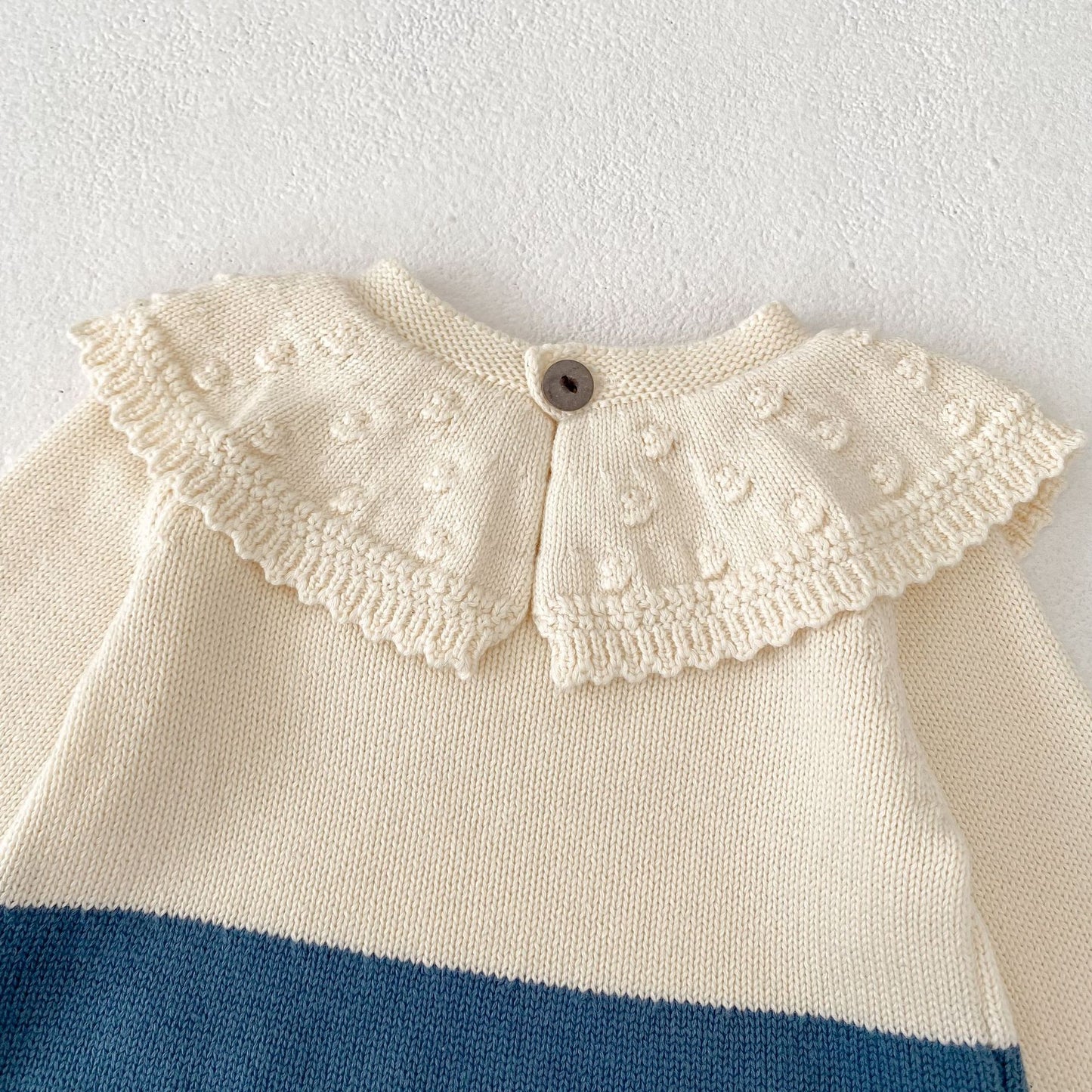 ヨーロピアンバイカラーニットロンパース